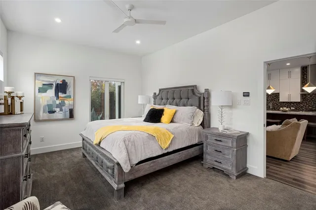 a bedroom with a bed and a couch