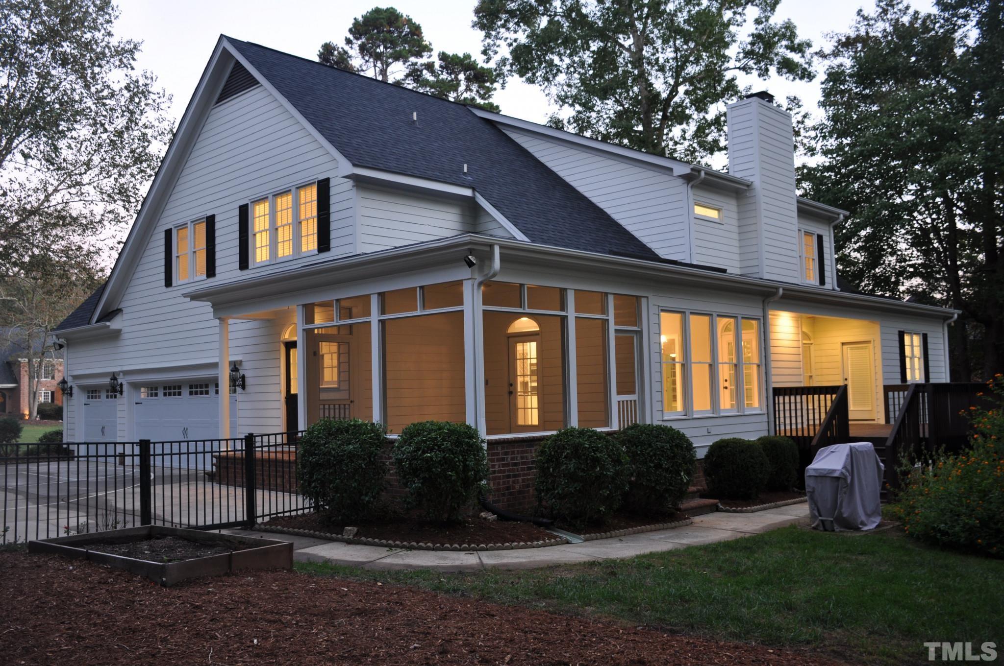 6617 Swallowtail Lane Raleigh, NC 27613 - Photo 6 of 30 a view of a house with a yard and plants