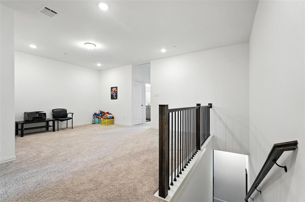 6535 Baritone Court Sachse, TX 75048 - Photo 15 of 24 a view of a hallway with workspace