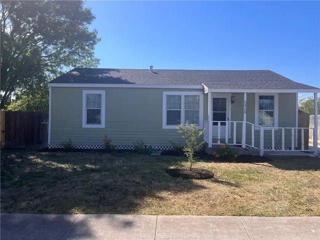 front view of a house with a yard