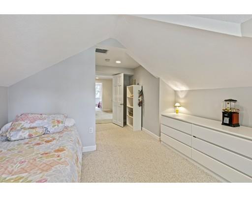 140 Cedar Street Lexington, MA 02421 - Photo 19 of 29 a hallway with a dresser and couch