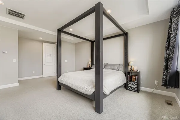 a bed room with a bed and a lamp