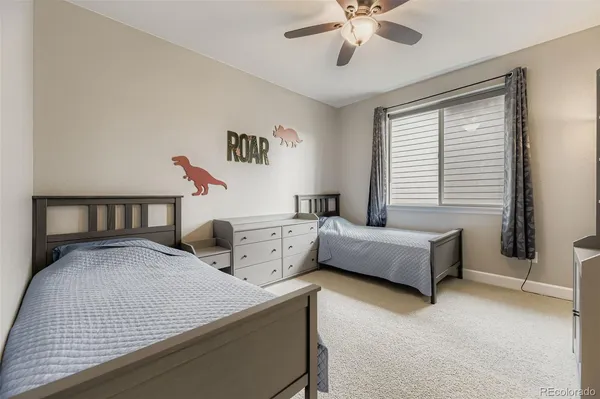 a bedroom with bed and window