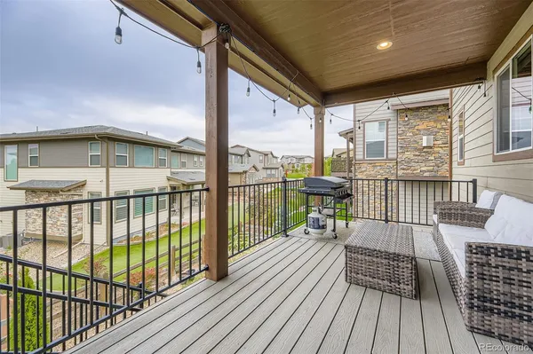 a view of balcony with wooden floor