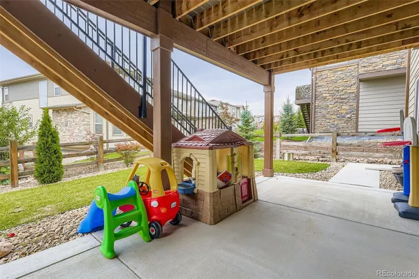 a view of yard with patio