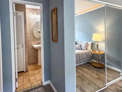 a bathroom with a sink a toilet and a shower