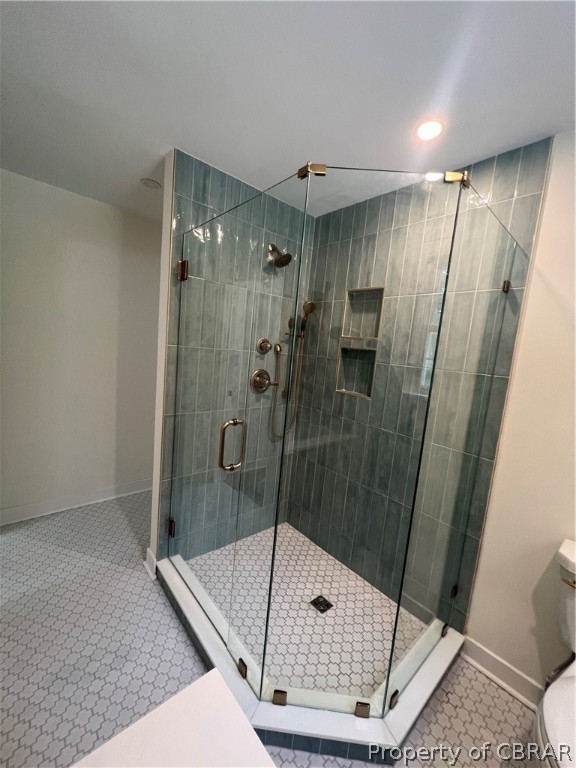 204 Pine Hall Road Mathews, VA 23109 - Photo 18 of 29 Primary 1st floor Bathroom featuring a tile shower and tile patterned floors