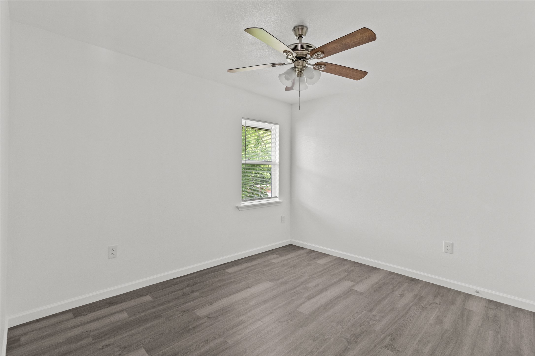 316 20th Street, Unit B San Leon, TX 77539 - Photo 5 of 11 an empty room with wooden floor window and closet