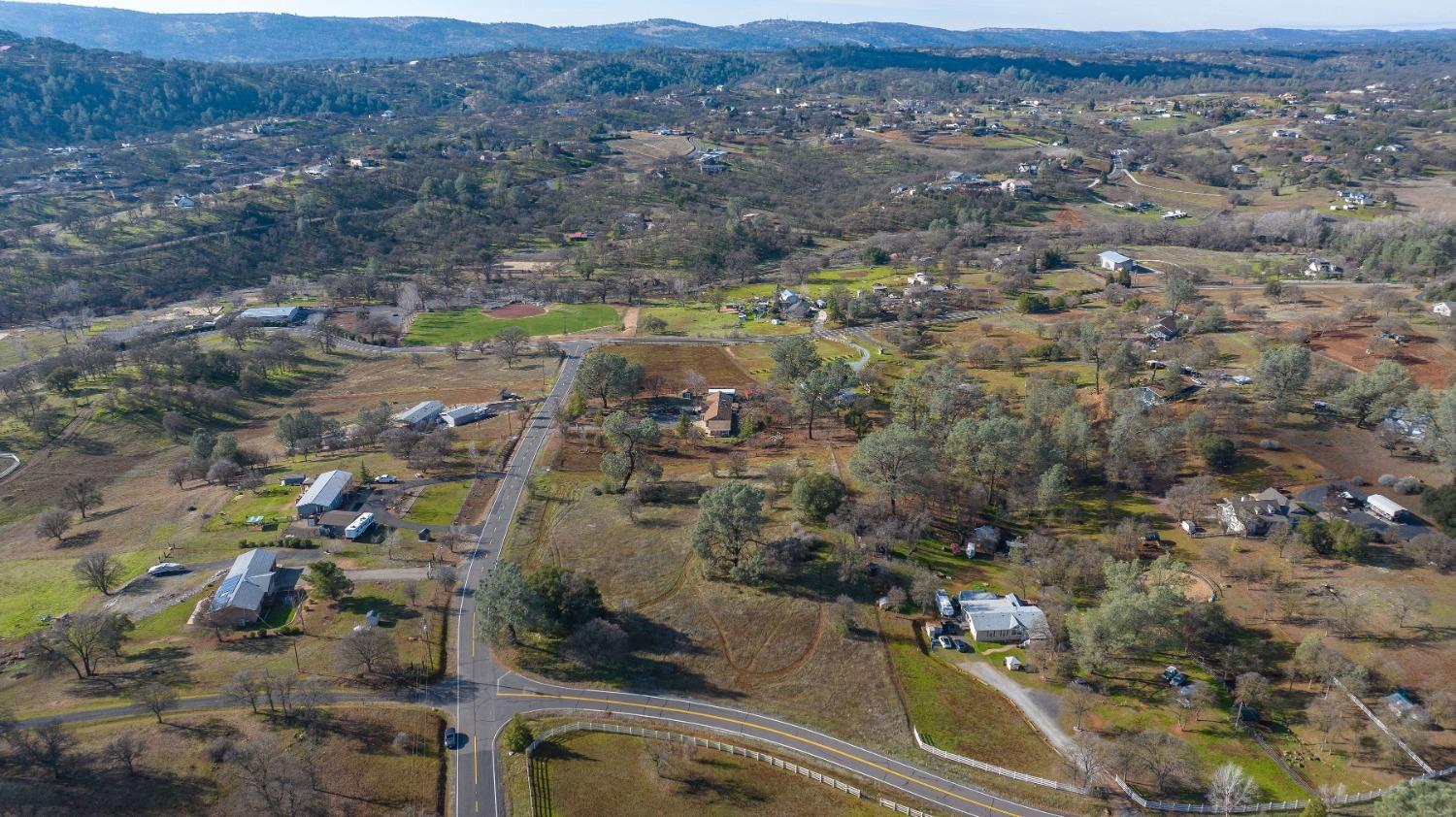 an aerial view of residential house and outdoor space