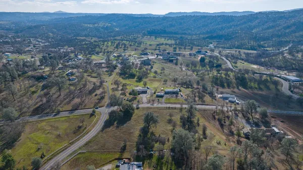 an aerial view of residential house and outdoor space