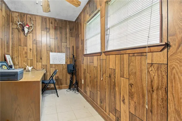 a view of a room with a door and furniture