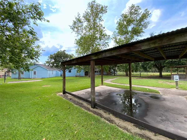 a view of a backyard with a sitting area