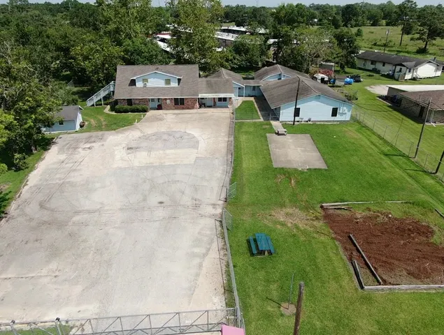 an aerial view of a house with a garden
