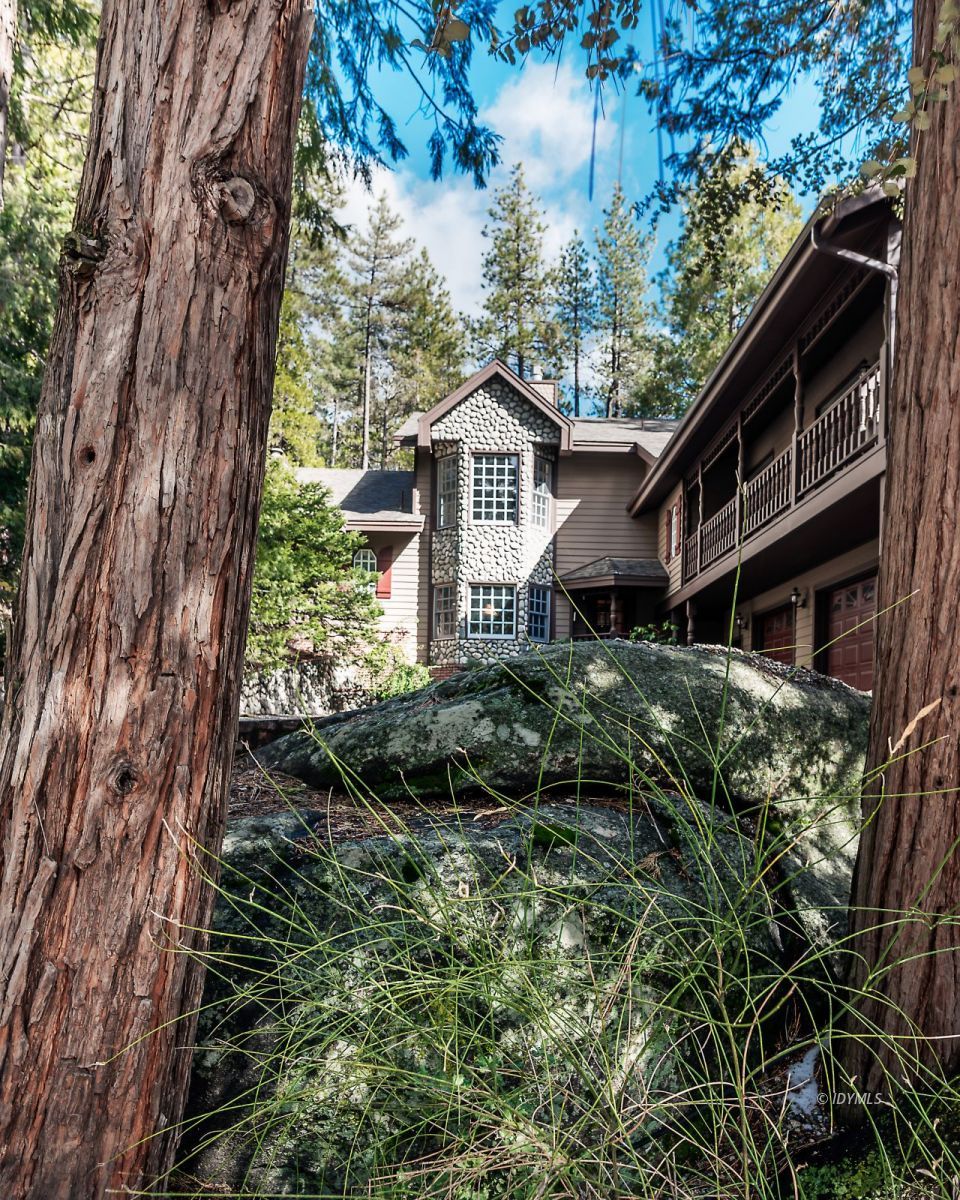 52595 Idyllmont Road Idyllwild, CA 92549 - Photo 2 of 58 a house is sitting in middle of the forest