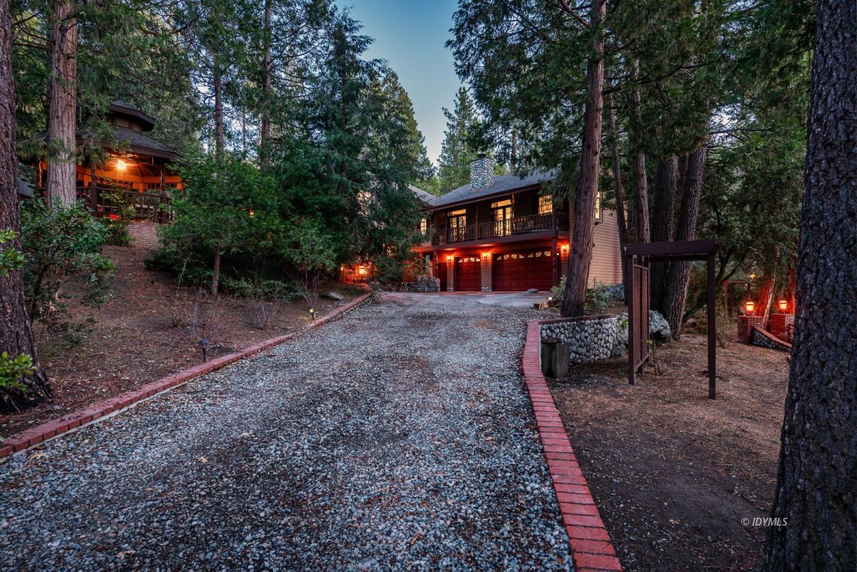 52595 Idyllmont Road Idyllwild, CA 92549 - Photo 12 of 58 a view of a house with a backyard and trees