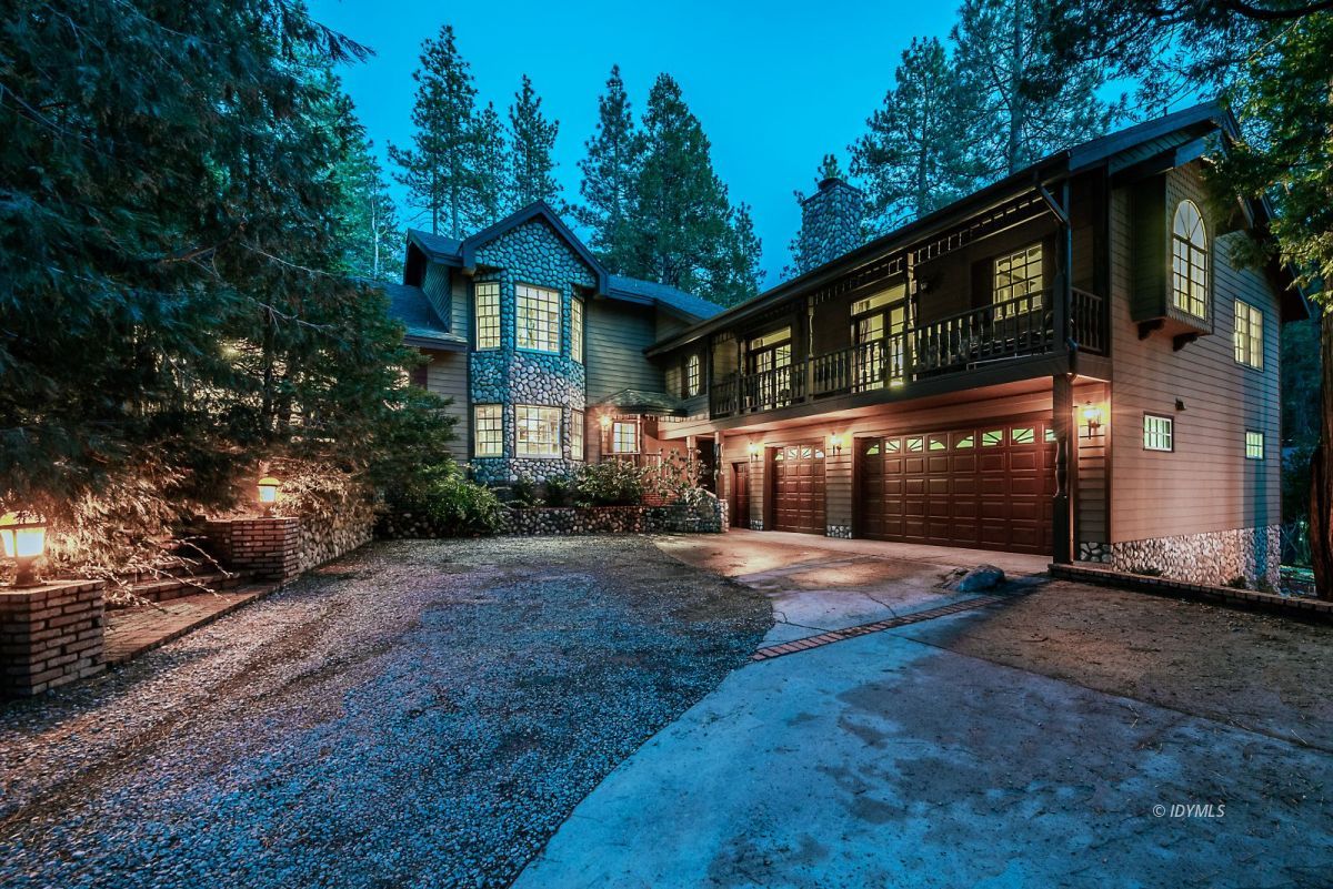 52595 Idyllmont Road Idyllwild, CA 92549 - Photo 13 of 58 a front view of a house with a yard and garage
