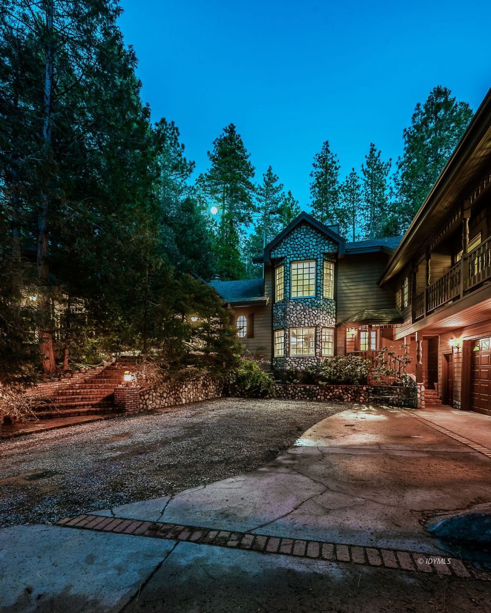 52595 Idyllmont Road Idyllwild, CA 92549 - Photo 14 of 58 a front view of a house with a yard