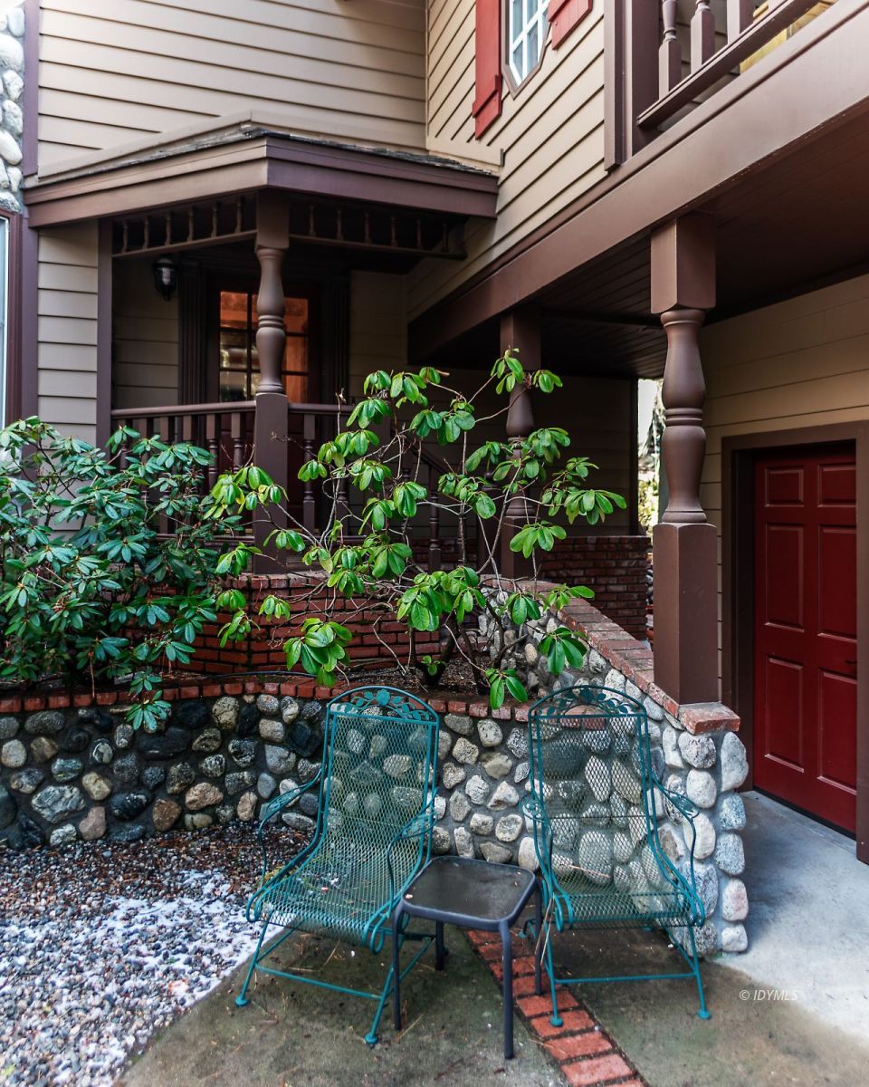 52595 Idyllmont Road Idyllwild, CA 92549 - Photo 15 of 58 a view of a patio with table and chairs and potted plants