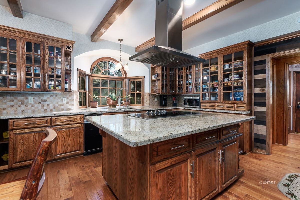 52595 Idyllmont Road Idyllwild, CA 92549 - Photo 28 of 58 a kitchen with stainless steel appliances granite countertop a stove and a sink