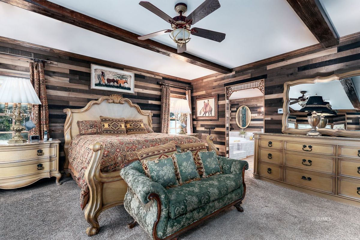 52595 Idyllmont Road Idyllwild, CA 92549 - Photo 32 of 58 a bedroom with a bed and a ceiling fan