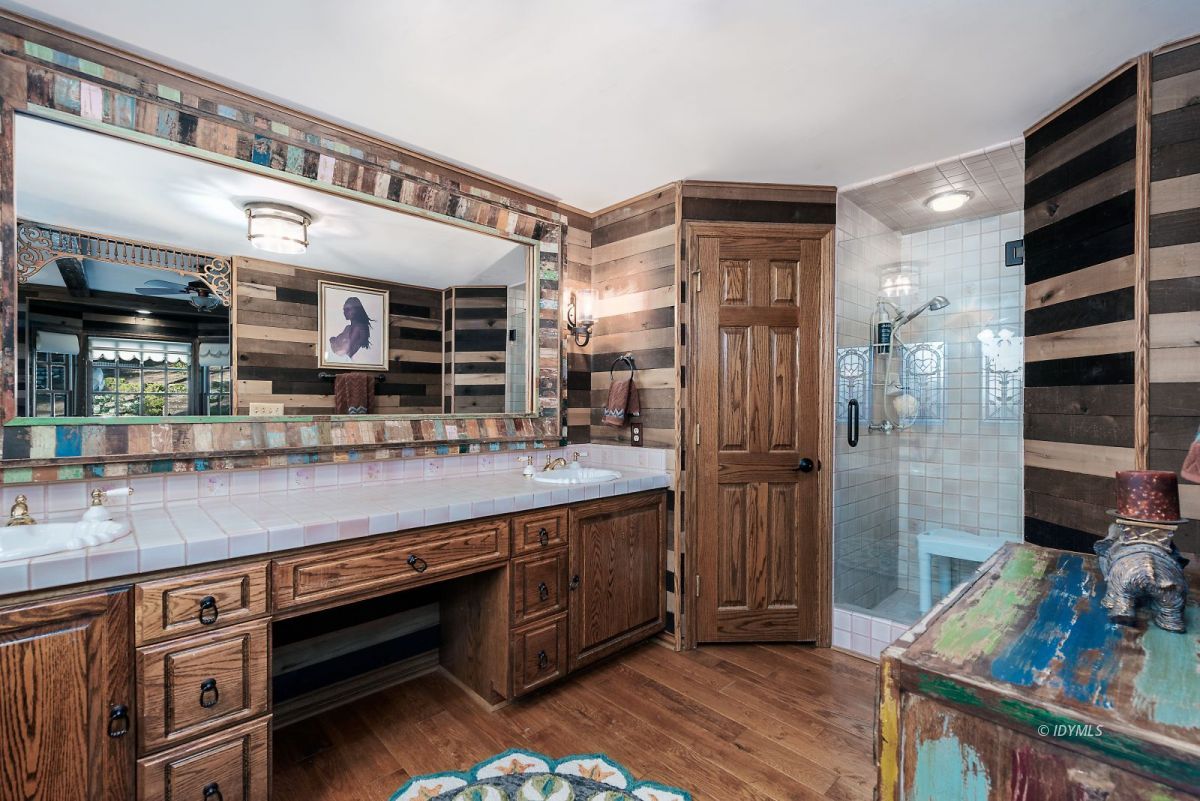 52595 Idyllmont Road Idyllwild, CA 92549 - Photo 36 of 58 a kitchen with stainless steel appliances granite countertop a sink and wooden cabinets