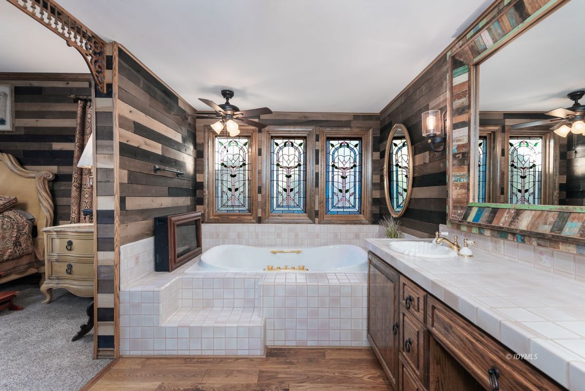 52595 Idyllmont Road Idyllwild, CA 92549 - Photo 37 of 58 a large white kitchen with cabinets a sink and a stove