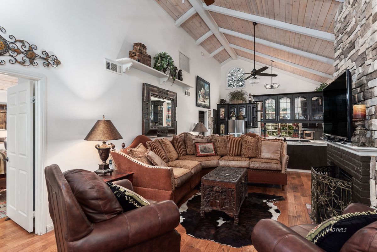 52595 Idyllmont Road Idyllwild, CA 92549 - Photo 42 of 58 a living room with furniture and a fireplace