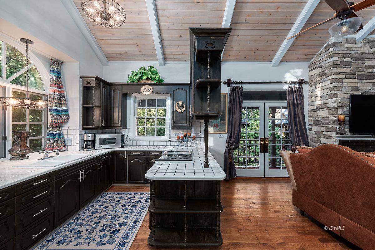 52595 Idyllmont Road Idyllwild, CA 92549 - Photo 47 of 58 a kitchen with a sink stainless steel appliances and furniture