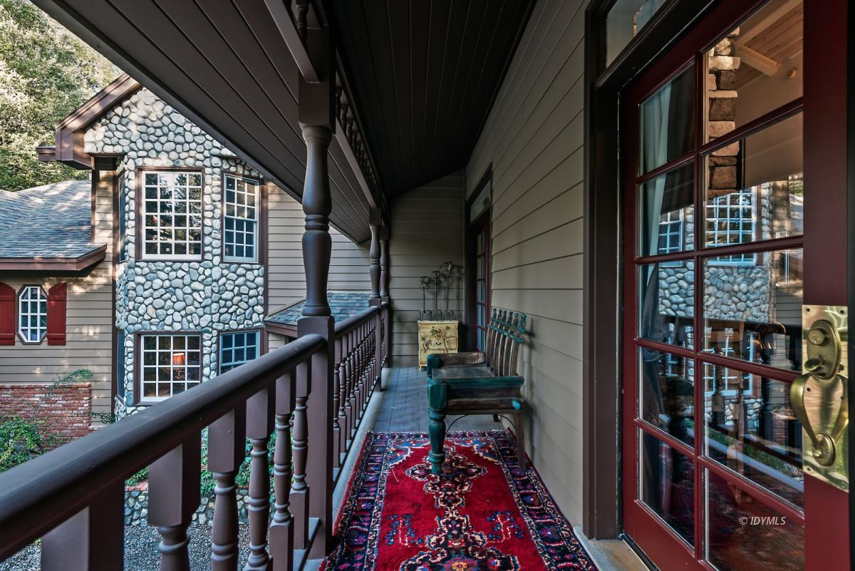 52595 Idyllmont Road Idyllwild, CA 92549 - Photo 49 of 58 a balcony view with a couple of chairs and wooden floor