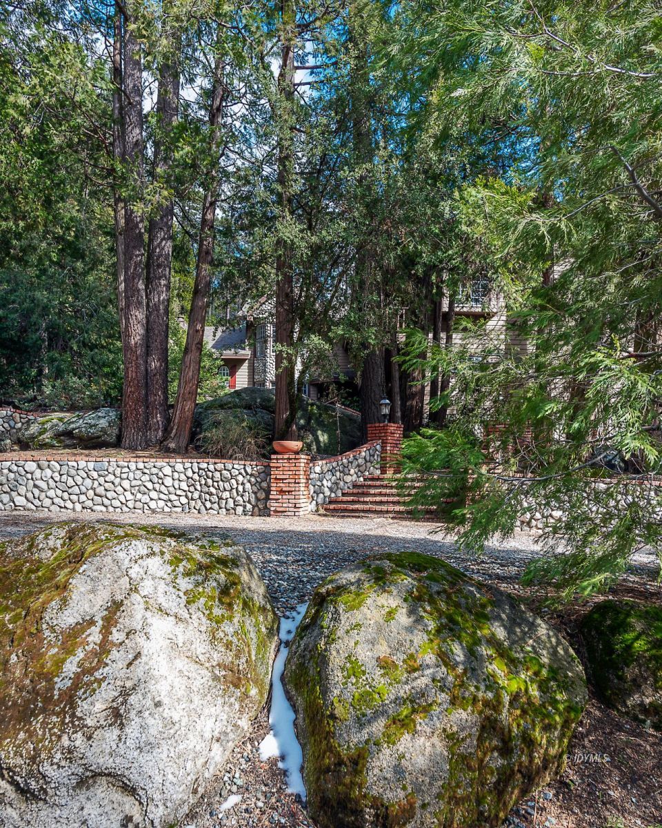 52595 Idyllmont Road Idyllwild, CA 92549 - Photo 6 of 58 a view of a swimming pool with a patio