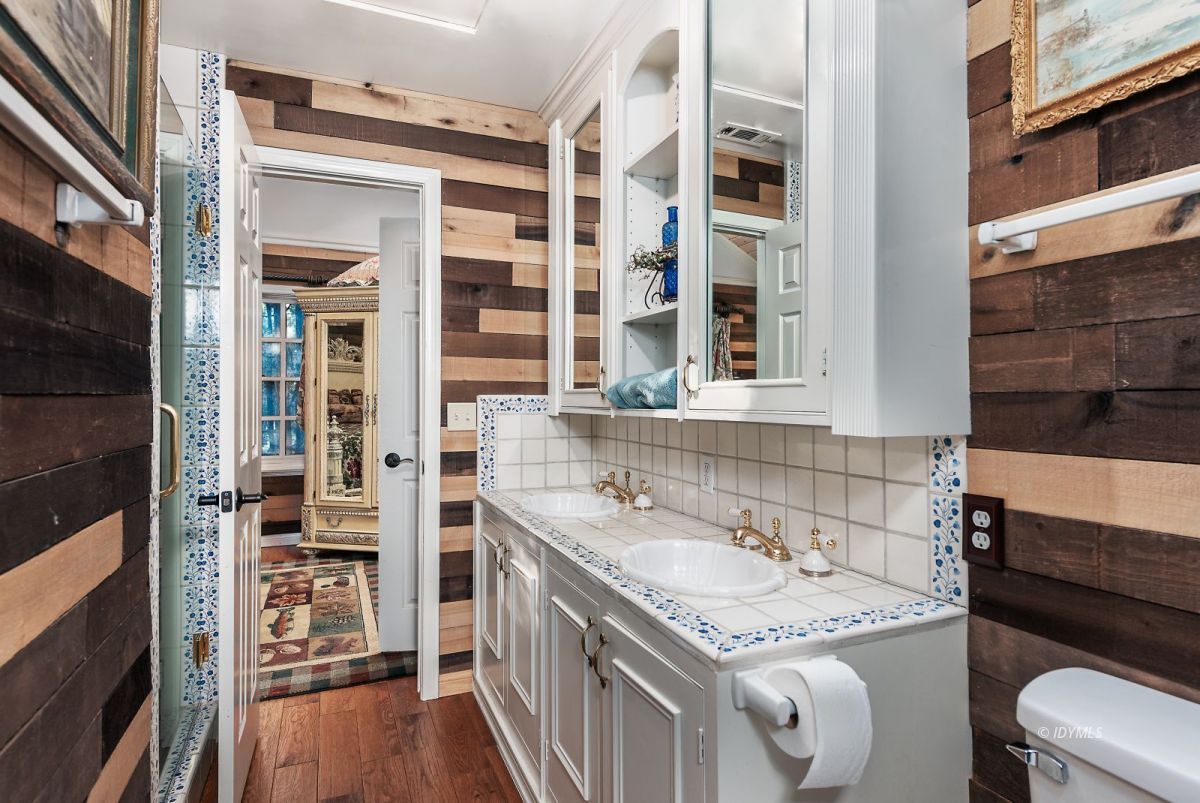 52595 Idyllmont Road Idyllwild, CA 92549 - Photo 52 of 58 a bathroom with a granite countertop sink and a toilet