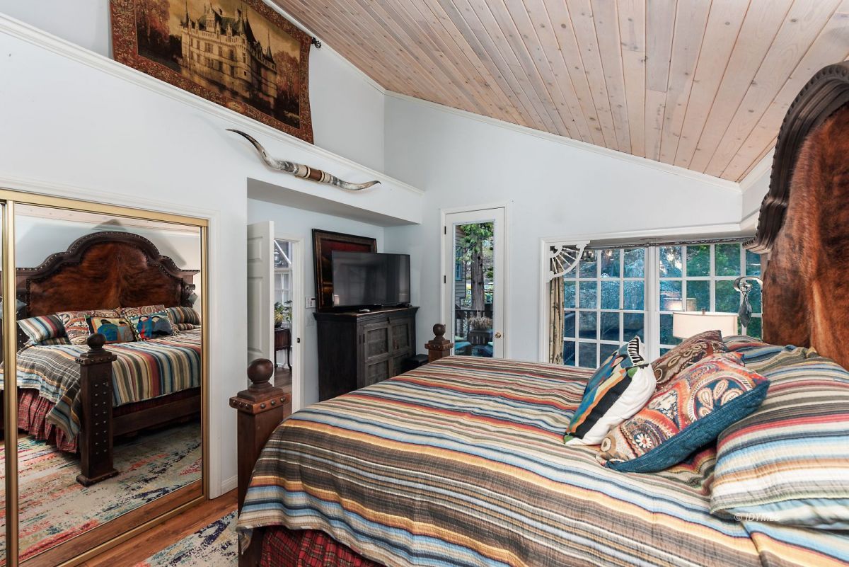 52595 Idyllmont Road Idyllwild, CA 92549 - Photo 54 of 58 a bedroom with furniture and a flat screen tv