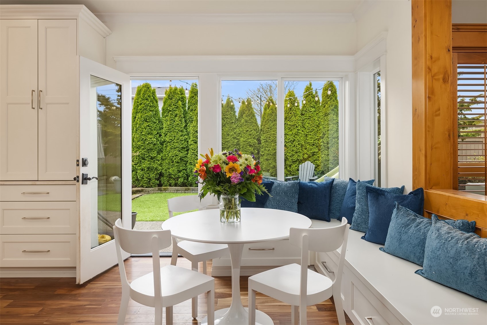 701 Cary Road Edmonds, WA 98020 - Photo 15 of 40 a view of a dining room with furniture window and wooden floor