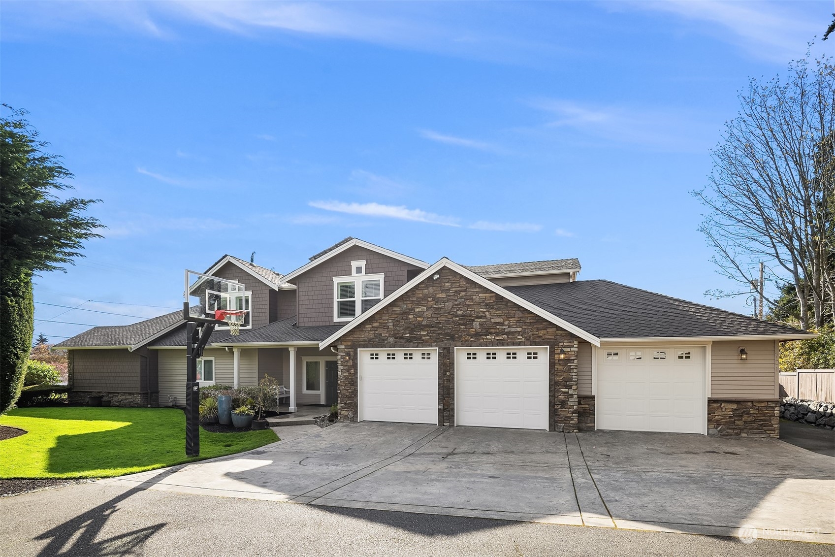701 Cary Road Edmonds, WA 98020 - Photo 37 of 40 a front view of a house with a yard and garage