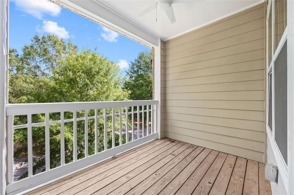 1752 Pryor Road Southwest, Unit 111 Atlanta, GA 30315 - Photo 17 of 21 a view of a balcony with wooden floor