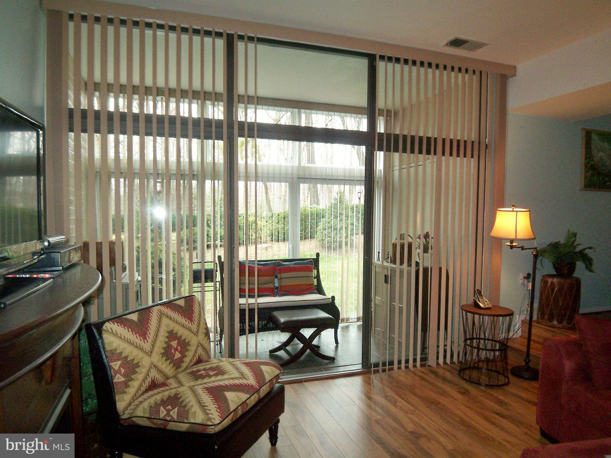1621 Parkcrest Circle, Unit 101 Reston, VA 20190 - Photo 4 of 13 Inviting Sun room with gorgeous Stone flooring