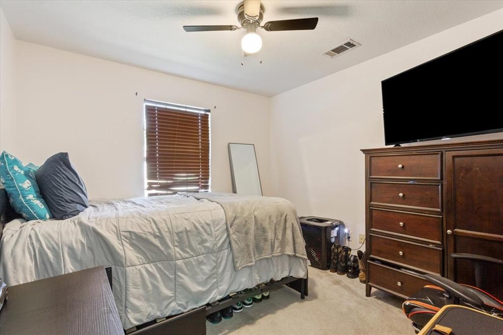 10817 Lilry Road Waco, TX 76708 - Photo 17 of 27 Bedroom with light carpet and ceiling fan