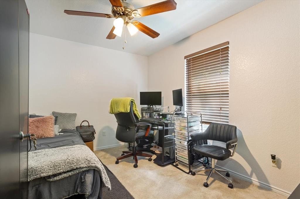 10817 Lilry Road Waco, TX 76708 - Photo 19 of 27 Bedroom featuring a desk, light carpet, and ceiling fan