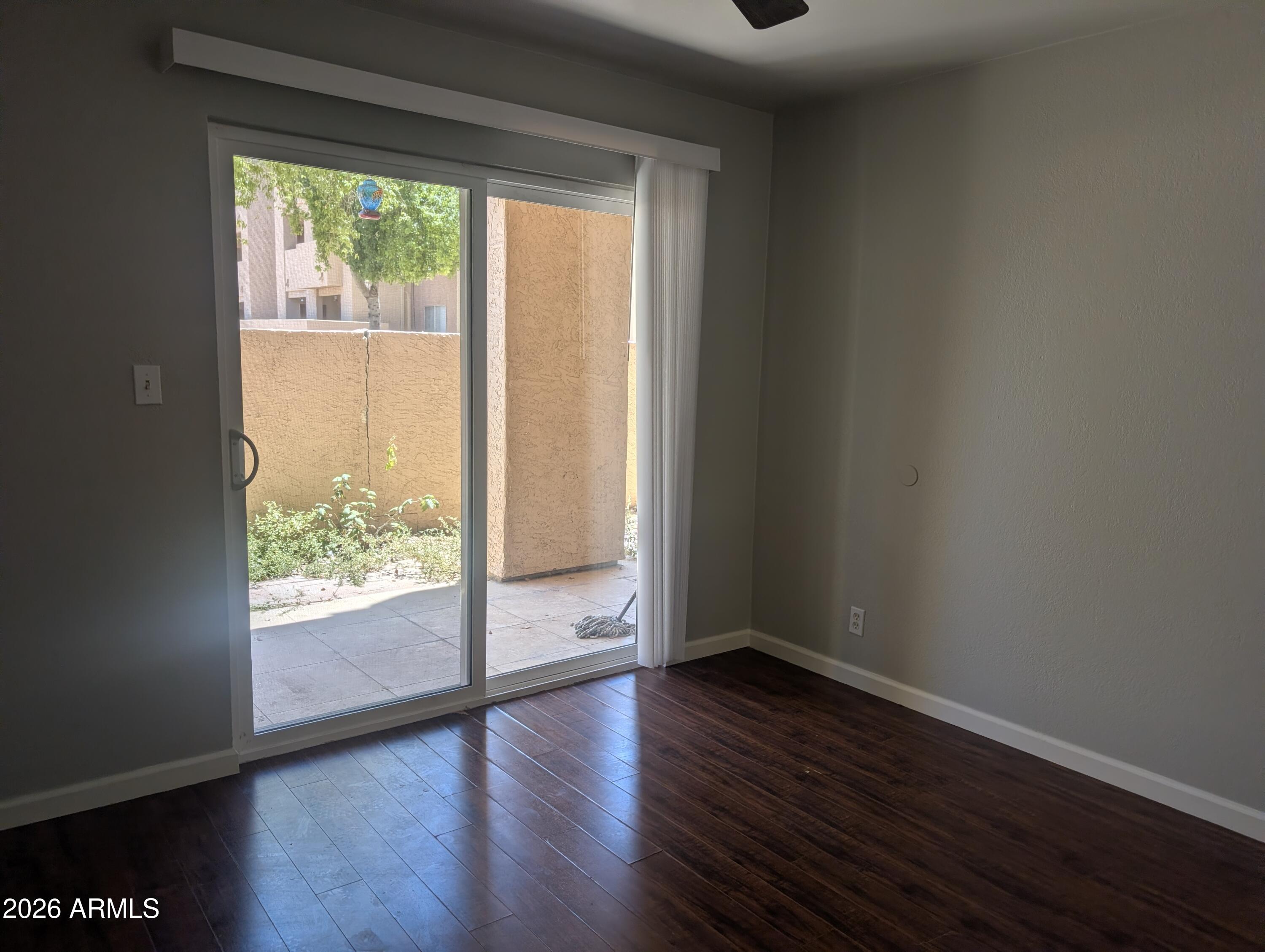 540 North May, Unit 1101 Mesa, AZ 85201 - Photo 9 of 15 Bedroom has doorway to patio