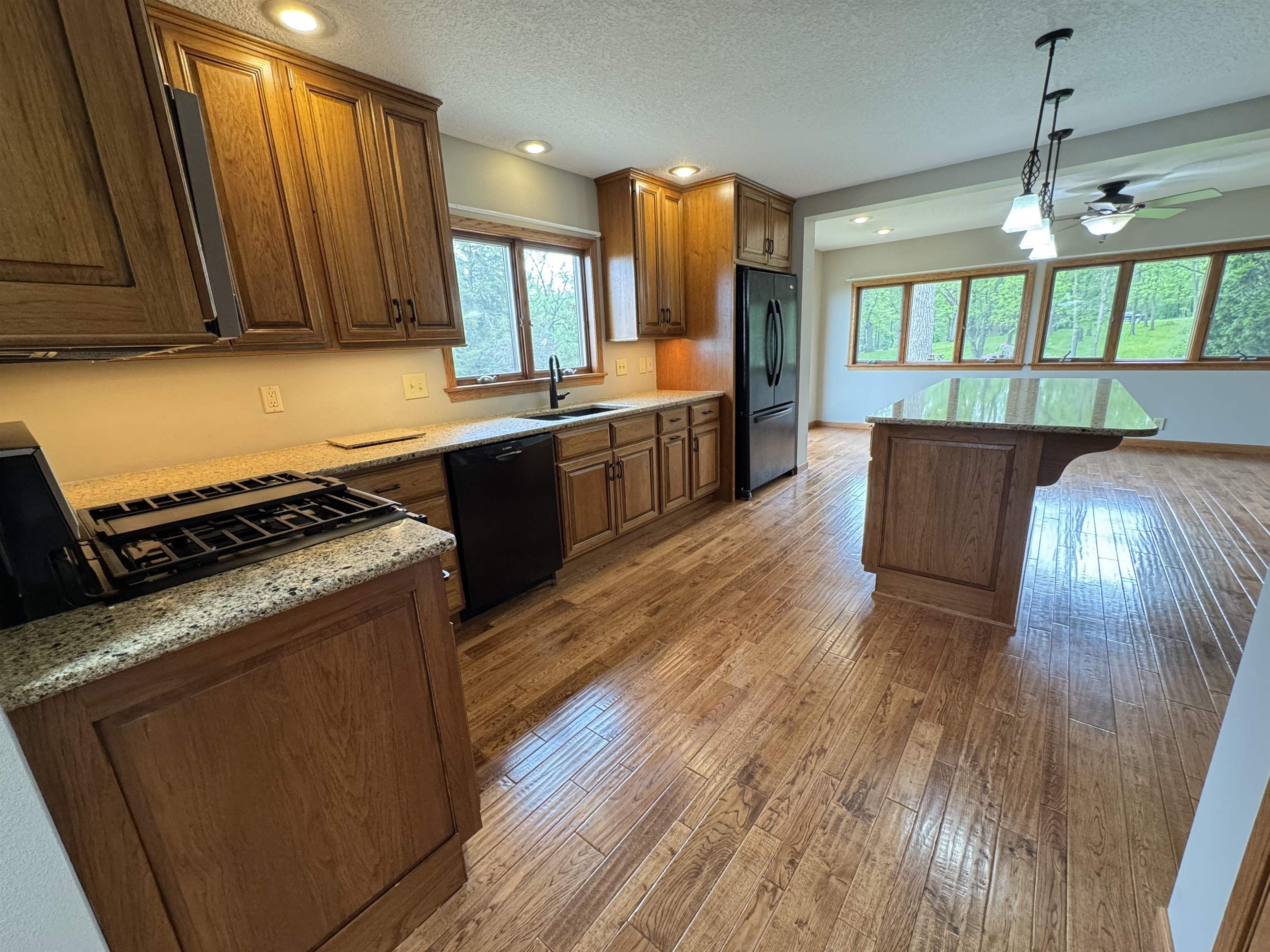 25303 Spring Valley Road Shannon, IL 61078 - Photo 7 of 22 a kitchen with wooden floors and a stove
