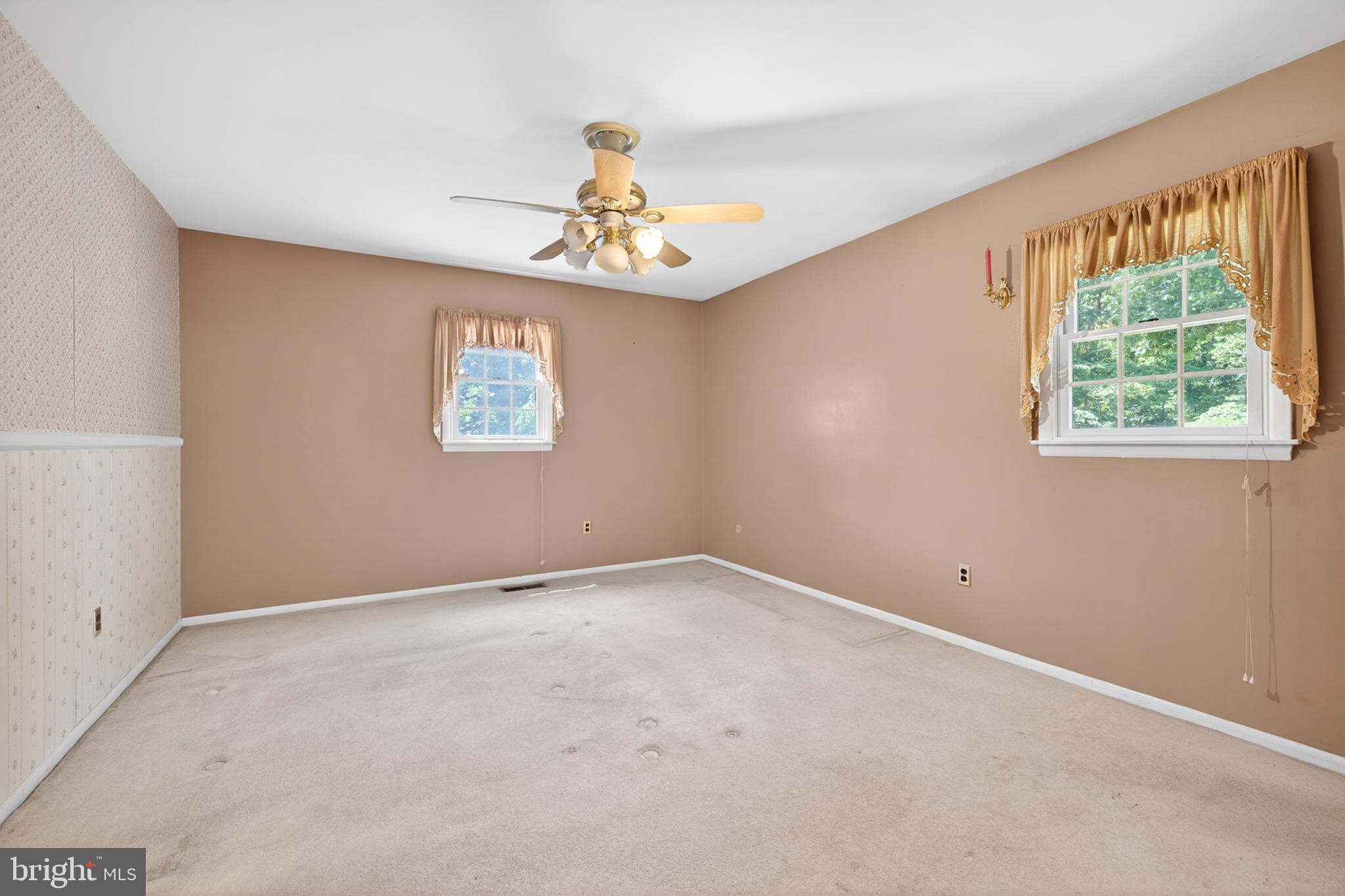 3701 Ebright Road Chadds Ford, PA 19317 - Photo 29 of 45 an empty room with windows and fan