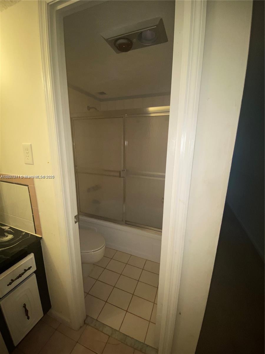 Inverrary Lauderhill, FL 33319 - Photo 11 of 14 a bathroom with a glass door shower