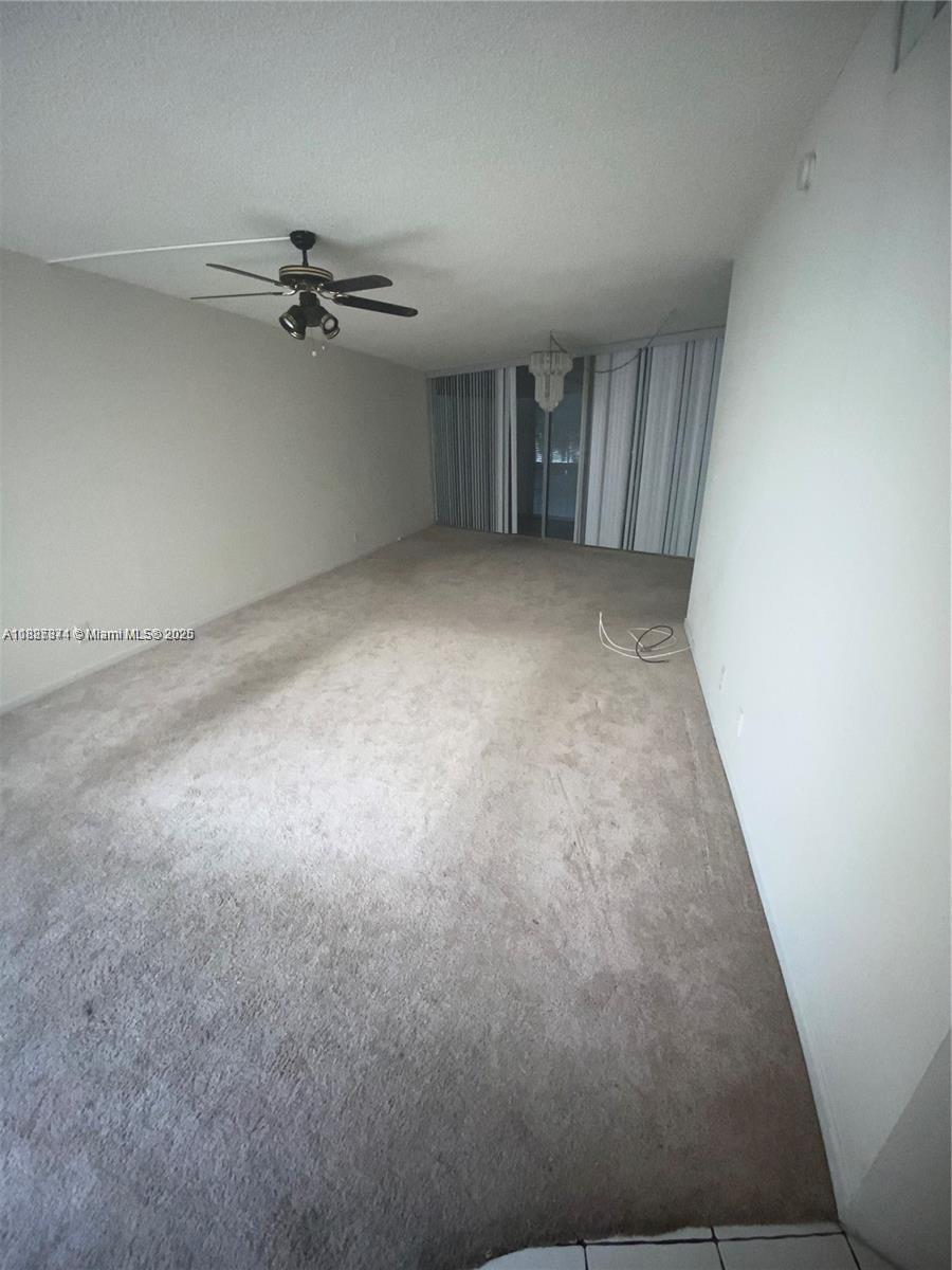Inverrary Lauderhill, FL 33319 - Photo 3 of 14 an empty room with a empty space and a ceiling fan