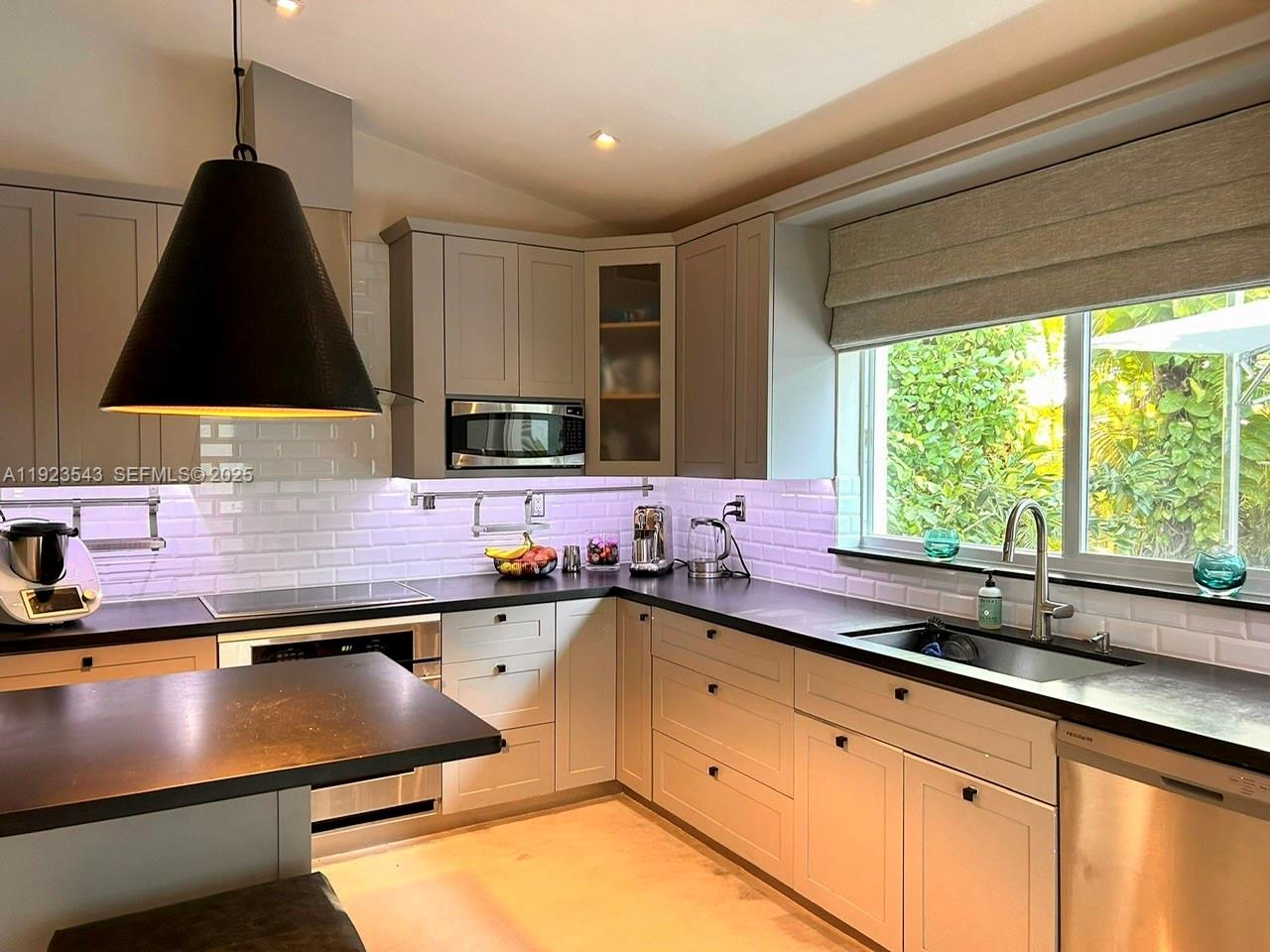 375 Harbor Court Key Biscayne, FL 33149 - Photo 12 of 58 a kitchen with a sink a counter top space and a window
