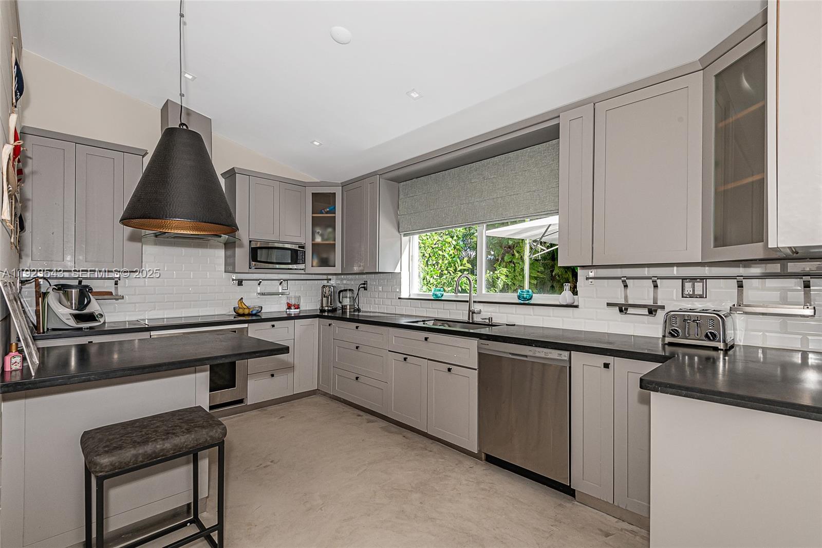 375 Harbor Court Key Biscayne, FL 33149 - Photo 14 of 58 a kitchen with granite countertop a sink stainless steel appliances and cabinets