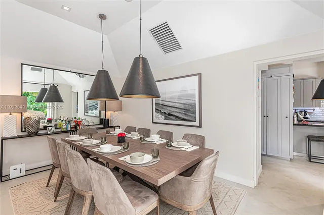 a bedroom with a bed and lamp