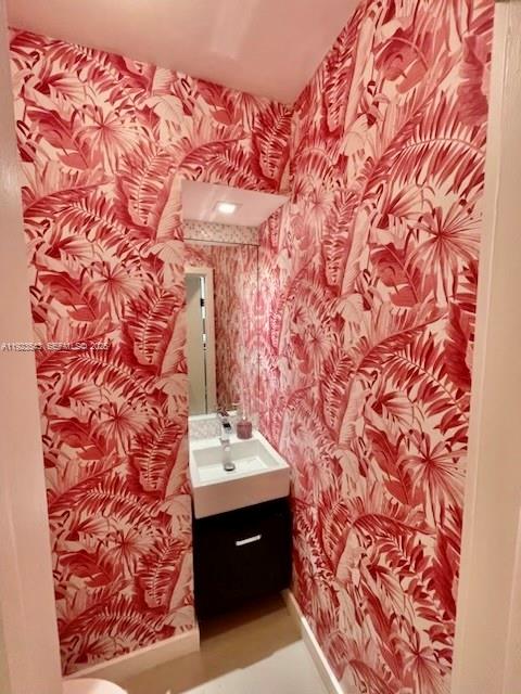 375 Harbor Court Key Biscayne, FL 33149 - Photo 25 of 58 a bathroom with a sink and a mirror