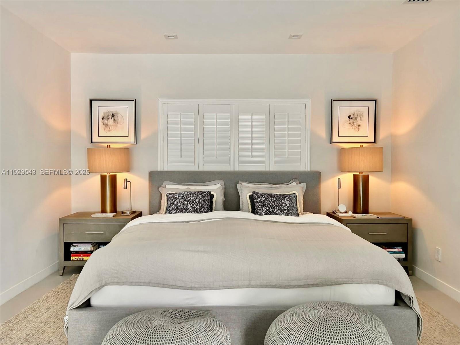 375 Harbor Court Key Biscayne, FL 33149 - Photo 27 of 58 a bedroom with a bed and lamp