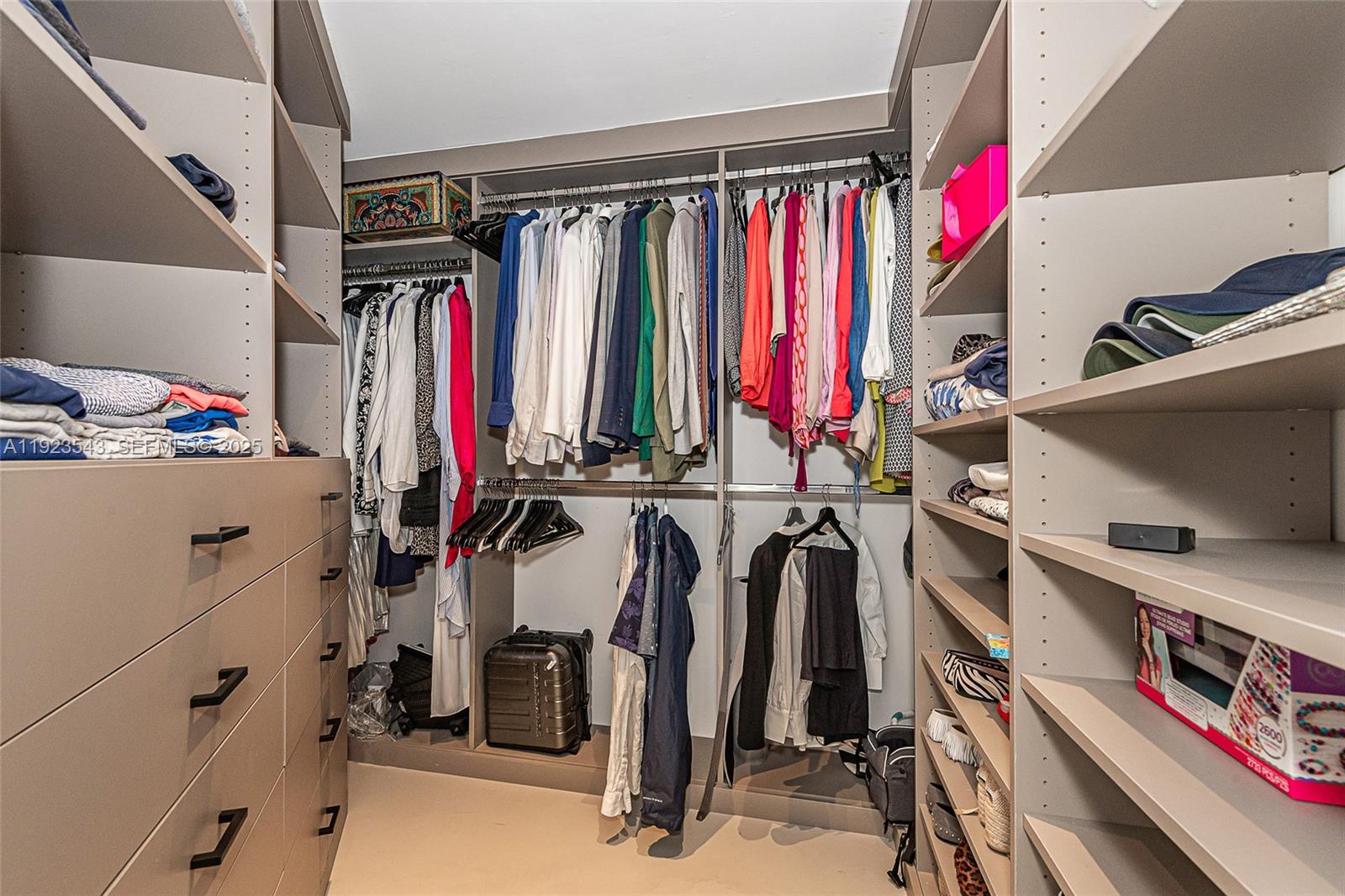 375 Harbor Court Key Biscayne, FL 33149 - Photo 32 of 58 a view of walk in closet with clothes