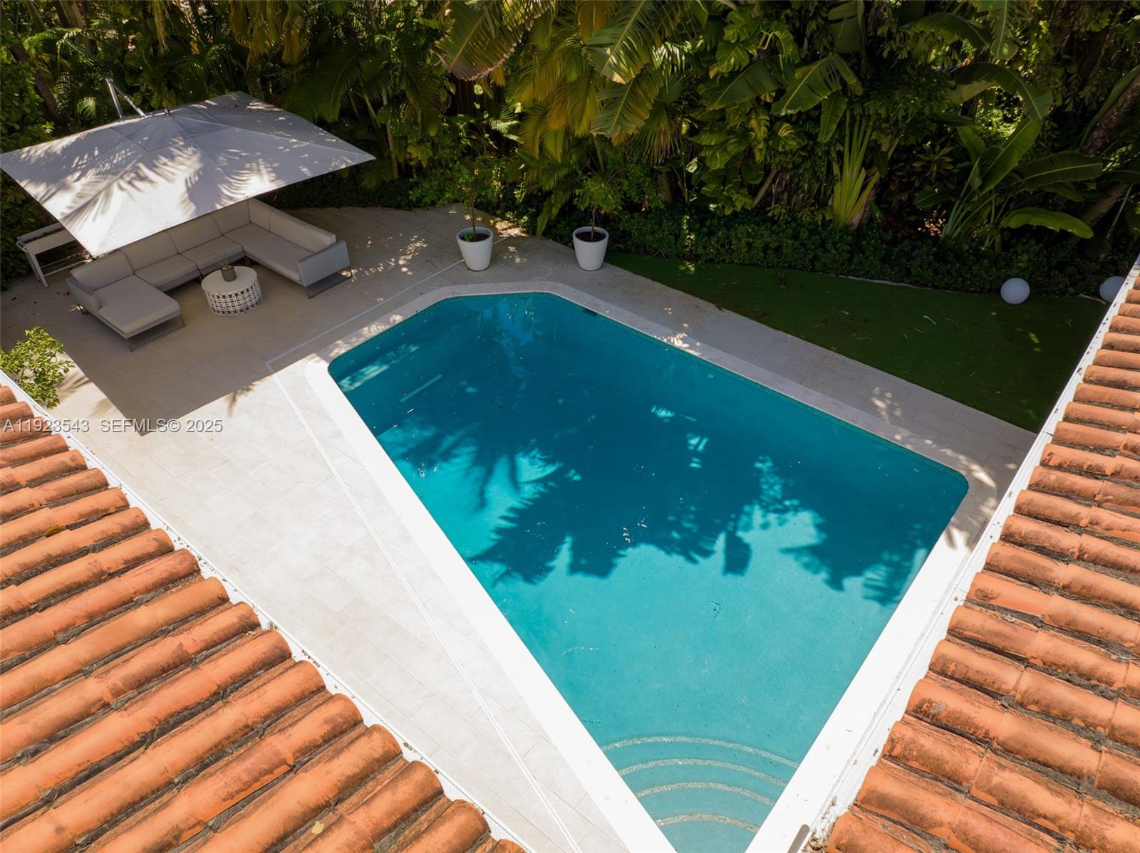 375 Harbor Court Key Biscayne, FL 33149 - Photo 6 of 58 a view of a swimming pool with a patio
